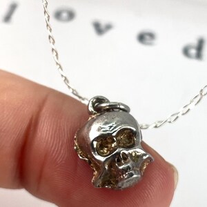 Vintage Sterling Silver Skull Charm can act as a "memento mori,",  Latin for "remember that you must die." vital living in the present moment and living fearlessly strength, resilience, and embracing mortality with boldness.