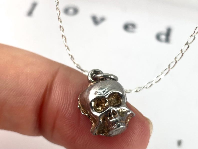 Vintage Sterling Silver Skull Charm can act as a "memento mori,",  Latin for "remember that you must die." vital living in the present moment and living fearlessly strength, resilience, and embracing mortality with boldness.