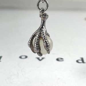 Vintage Sterling Silver Dragons Claw or Eagles Talon Claw with vintage pearl strength, guidance, courage, farsightedness, immortality ability to speak honestly.  The Eagle is considered the king of the air and the messenger of the highest Gods.