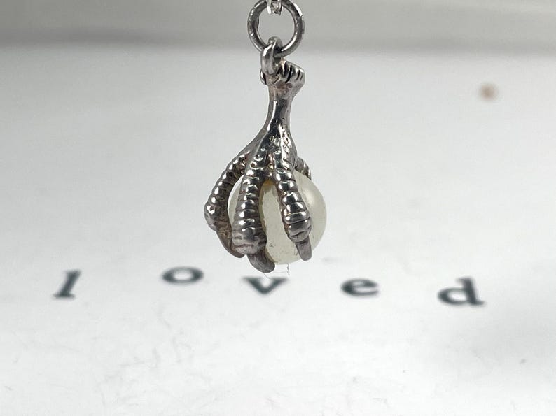Vintage Sterling Silver Dragons Claw or Eagles Talon Claw with vintage pearl strength, guidance, courage, farsightedness, immortality ability to speak honestly.  The Eagle is considered the king of the air and the messenger of the highest Gods.
