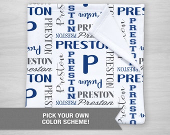 May include: White baby blanket with a blue and gray pattern of the name Preston repeated throughout. The blanket is folded in half and the text "PICK YOUR OWN COLOR SCHEME!" is printed below the blanket.