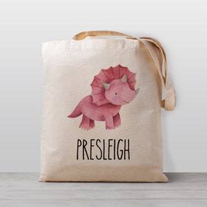 Sac fourre-tout personnalisé pour enfant, dinosaure tricératops rose avec prénom pour fille ou homme neutre, sac d'école, d'école maternelle ou de garderie en toile