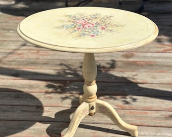Vintage French Provincial style tilt-top pedestal table  a hand-painted floral design on a creamy white/ivory finish