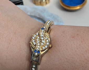 Vintage R Miller Gold Tone Bangle Peek a boo Watch with Snake Rhinestones