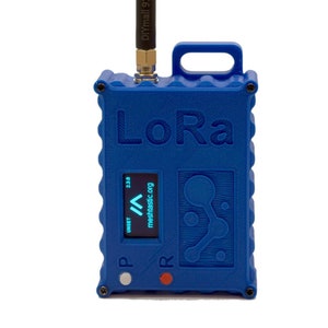 May include: A blue plastic device with a black antenna labeled "DIYmall 915MHz". The device has a blue screen with the text "UNSET" and "meshastic.org" and the number "2.2.0". The device has the word "LoRa" printed on it and two buttons labeled "P" and "R".