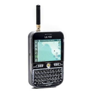 May include: A black and silver LILYGO handheld device with a screen displaying a map. It has a full keyboard, an antenna, and the text "LILYGO" is visible. The screen shows a map with icons and a battery indicator.