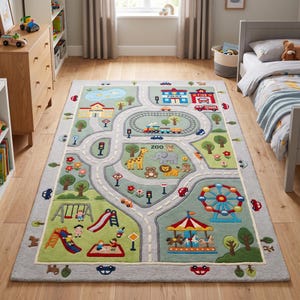 May include: A rectangular area rug featuring a colourful play city map design. The rug displays a winding road, a train track, a zoo with animals, a playground with slides and swings, a school, a police station, a fire station, and a carousel.