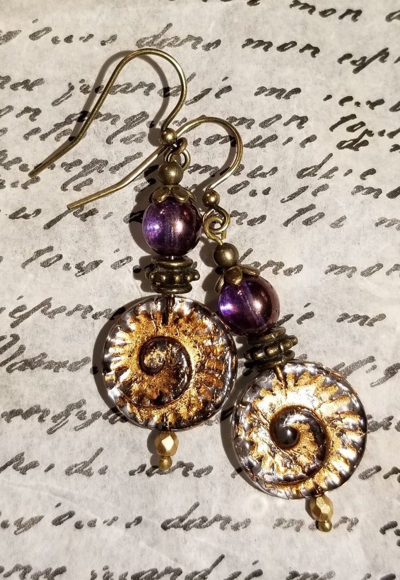 Purple Czech glass nautilus earrings image 1