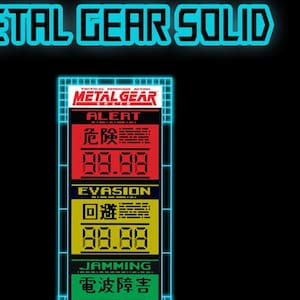 May include: A blue and black sticker with the text "METAL GEAR SOLID" and a digital display with the text "METAL GEAR" and the words "ALERT", "EVASION", and "JAMMING" in Japanese and English.