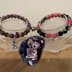 Clawdeen and Draculaura bracelets