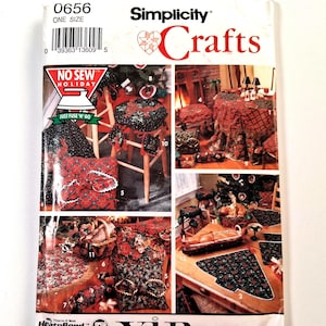 May include: A Simplicity Crafts sewing pattern envelope, number 0656, featuring No Sew Holiday designs. The front displays various fabric projects including table covers, chair cushions, and decorative items with red, green, and black holiday prints.
