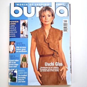 May include: A vintage magazine cover featuring the text "burda" and "WORLD OF FASHION". The cover model is wearing a brown suede dress. The magazine includes articles on fashion trends and home decor.