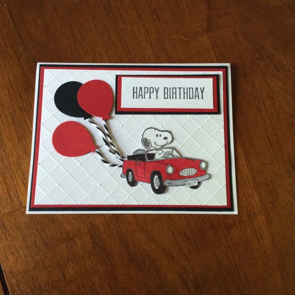 Red and black snoopy in car handmade birthday card