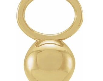 May include: A gold-toned metal charm with a round ball at the bottom and a ring at the top.