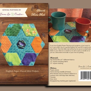 May include: A sewing pattern for a heart-shaped mini mat, made with English paper piecing. The pattern includes instructions for cutting fabric, piecing the blocks, and finishing the mat. The pattern is designed for a 12-inch square mat.