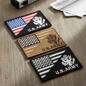 May include: Three embroidered U.S. Army patches with American flag and eagle designs. The patches feature red, white, and blue, tan, and black color schemes. Each patch has the words "U.S. ARMY" in white lettering.