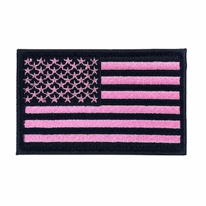May include: A rectangular embroidered patch featuring a stylized American flag design. The canton displays pink embroidered stars on a black background, while the field consists of alternating horizontal pink and black embroidered stripes.