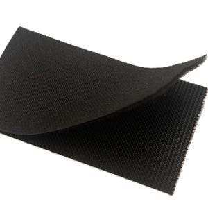 May include: A rectangular piece of black hook and loop fastener material. The top layer is folded back to reveal the textured, woven surface of the fabric. The material has a consistent dark black color and a uniform, fine-grained grid pattern.