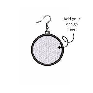 May include: A single earring with a circular design, featuring a textured white surface within a black border. The earring has a silver hook. Text on the right says "Add your design here!"
