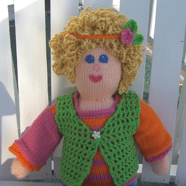 Molly, a hand knitted doll with two outfits