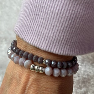 Set of a lavendar 8MM bracelet with a purple 6MM monochromatic beaded bracelets both designed with crystal and silver beads.