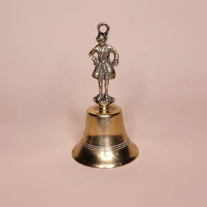 Vintage Solid Brass Hand Bell with Figurine Handle - Collectible Desk Bell