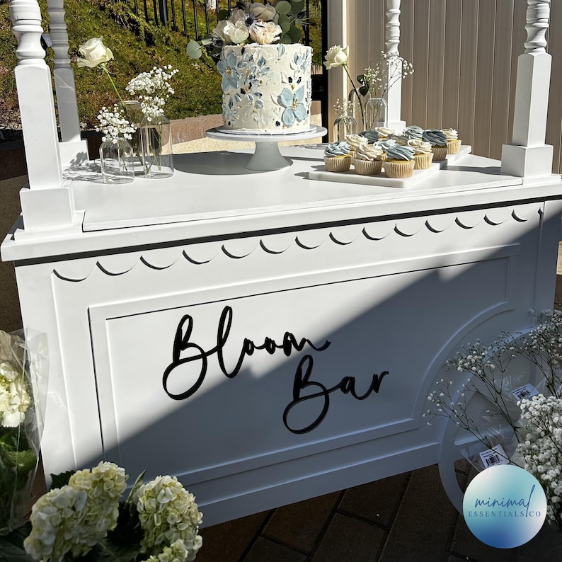 Bloom Bar wood sign cut from 1/4" plywood shown on a dessert cart painted in satin black