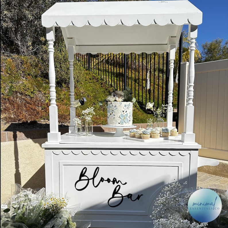 Bloom Bar wood sign cut from 1/4" plywood shown on a dessert cart painted in satin black