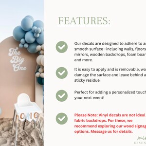 May include: A white vinyl decal with the text The Big One in a retro font, displayed on a beige arched backdrop decorated with blue and white balloons. The image includes a list of features regarding application, removability, and surface compatibility.