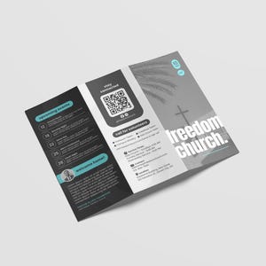 May include: A tri-fold brochure with a modern design, featuring the text "Freedom Church." The brochure includes a QR code, event listings, and contact information. The color scheme is primarily black, white, and teal.
