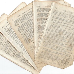 May include: A stack of old, yellowed pages from a book about math. The pages are filled with handwritten notes and equations. The text on the pages includes the words "Addition of Compound Numbers", "Miscellaneous", and "Supplement to Interest".