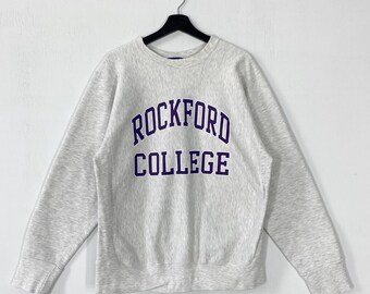 Vintage des années 90 Rockford College sweat ras du cou pull Rockford Regents impression logo gris moyen