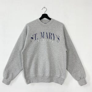 Sudadera vintage de los años 90 de St Mary&#39;s College, jersey de cuello redondo de St Mary&#39;s College, jersey con estampado de los St Mary&#39;s Gaels, logotipo gris mediano
