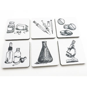 May include: Set of six white square coasters with black and white illustrations of medical and science related items. The illustrations include pills, a syringe, a beaker, a microscope, and bottles.