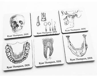 May include: Six white square coasters with black and white illustrations of dental anatomy. Each coaster has the text "Ryan Thompson, DDS" printed on it.