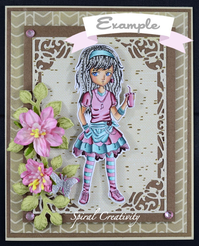 May include: A colorful card with a cartoon girl holding a pink drink. The girl has long gray hair, a pink shirt, and blue and pink striped tights. The card has a brown background with a white border and a pink ribbon with the word "Example" on it. The card also has a green floral design and the words "Spiral Creativity" at the bottom.