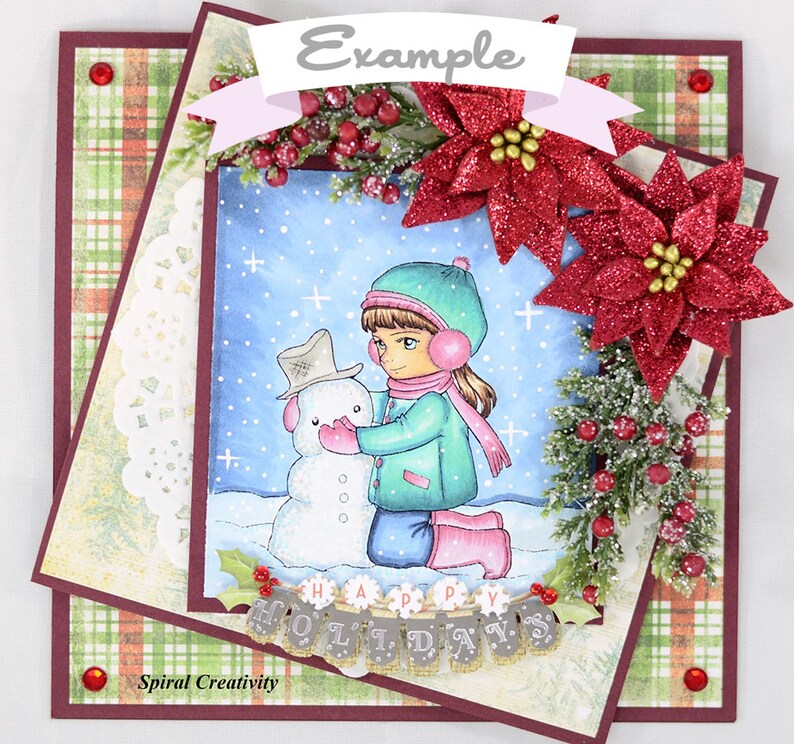 May include: A winter-themed card with a girl in a green coat and pink hat building a snowman. The card features a red plaid background, a white doily, and a banner that reads "Happy Holidays".