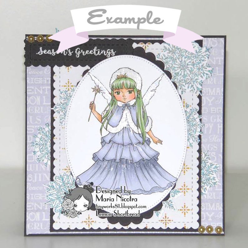 May include: A greeting card featuring a winter fairy illustration. The fairy is wearing a blue dress, white fur trim, and a crown. The card has a scalloped border and a white background with a snowflake pattern. The text on the card reads "Season's Greetings" and "Designed by Maria Nicotra".