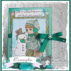 May include: A green and white card with a girl and a snowman. The card has the text "Time for making frosty snowmen and lots of warm memories!" and "Example". The card is designed by Deanne Saunders and is called "Lemon Shortbread".