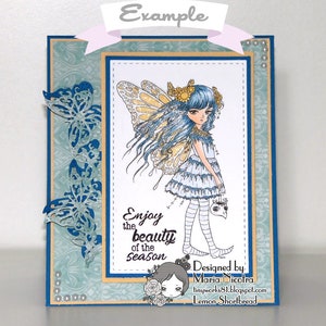 May include: A blue and white card featuring a fairy illustration and the text "Enjoy the beauty of the season". The card is decorated with blue butterflies and pearls.