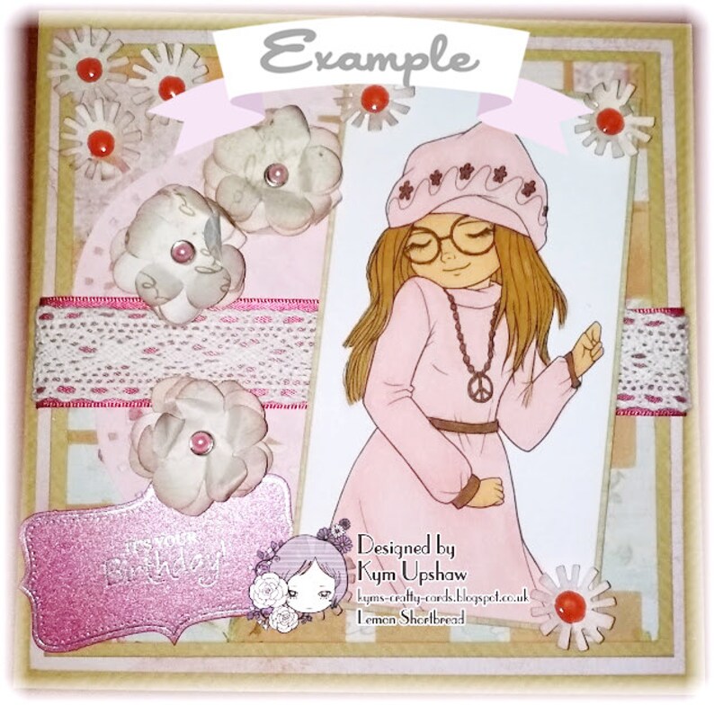 May include: A pink card with a girl wearing a pink hat and a pink sweater. The card has a white lace ribbon and a pink flower. The text on the card says "Example" and "Designed by Kym Upshaw Lemon Shortbread".