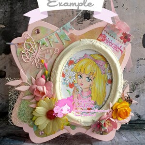 May include: A pink and white card with a white oval frame featuring a cartoon girl with blonde hair and a pink bow. The card is decorated with flowers, butterflies, and a banner that says "Celebrate!"