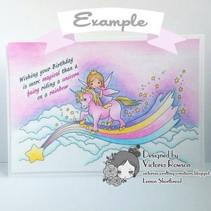 May include: A pink and purple watercolor card with a fairy riding a unicorn on a rainbow. The card has the text "Wishing your Birthday is more magical than a fairy riding a unicorn on a rainbow." and "Designed by Victoria Rowson" with a website address and the words "Lemon Shortbread".