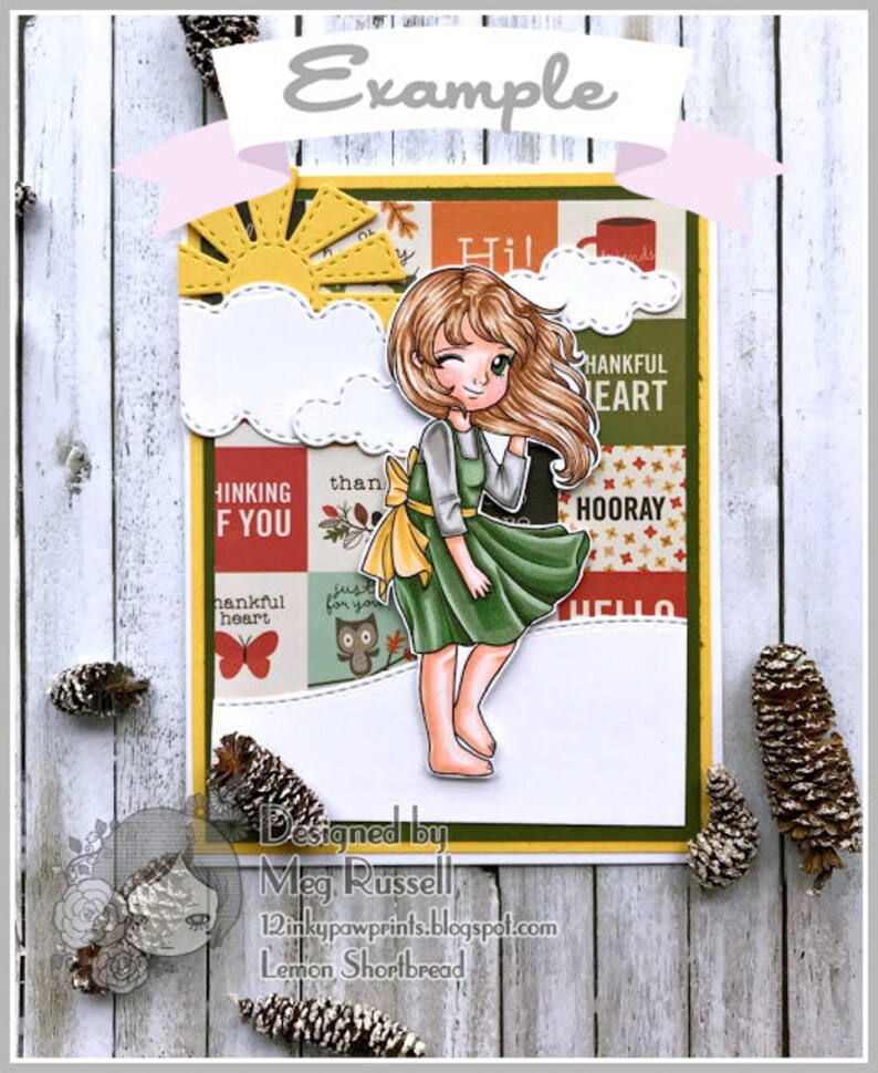 May include: A colorful card with a cartoon girl wearing a green dress and a yellow bow. The card has a patchwork design with words like "Thinking of You", "Thankful Heart", and "Hooray".