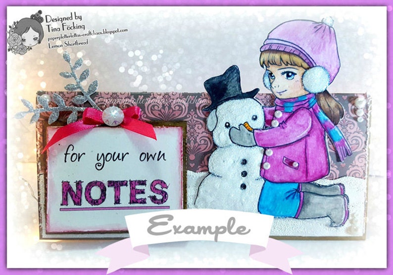 May include: A girl in a pink coat and blue scarf builds a snowman with a black top hat. The snowman has a carrot nose and black eyes. The background is a pink and brown patterned paper with a silver glitter branch and a red ribbon. The text "for your own NOTES" is on a white sign with a pink border.