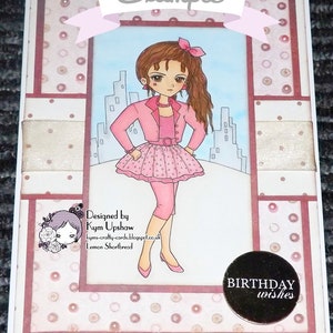 May include: A pink and white birthday card with a cartoon girl wearing a pink jacket and skirt. The card has a white background with pink polka dots and a black circle with the text "BIRTHDAY wishes".