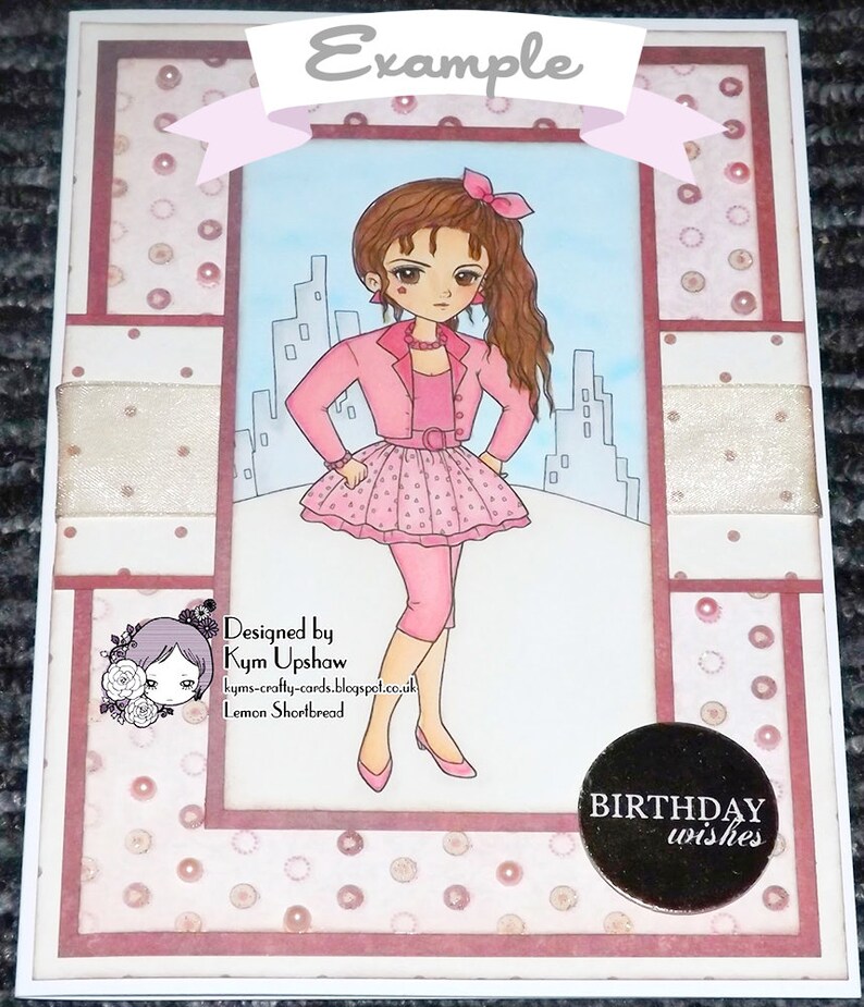 May include: A pink and white birthday card with a cartoon girl wearing a pink jacket and skirt. The card has a white background with pink polka dots and a black circle with the text "BIRTHDAY wishes".