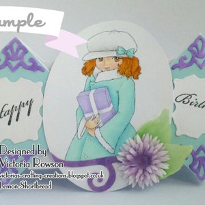 May include: A handmade card with a blue and purple design. The card features a girl holding a gift and the words "Happy Birthday".