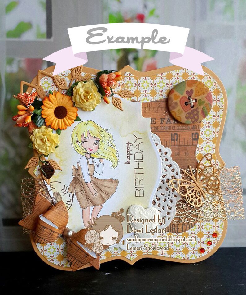 May include: A handmade birthday card with a brown frame and a yellow, white, and brown patterned background. The card features a girl with blonde hair wearing a brown dress and a white apron. The card also includes a brown bow, a gold butterfly, and a white doily. The text "happy birthday" is written in brown on the card. The card is designed by Dewi Lestari.