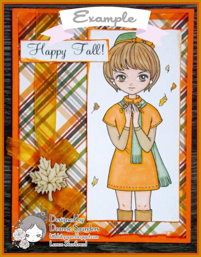Peut inclure: Une carte sur le th&egrave;me de l'automne avec une fille en robe marron et &eacute;charpe verte, tenant un bouquet de fleurs. L'arri&egrave;re-plan est un motif &agrave; carreaux orange, marron et blanc. La carte dit "Happy Fall!" et "Designed by Deanne Saunders".